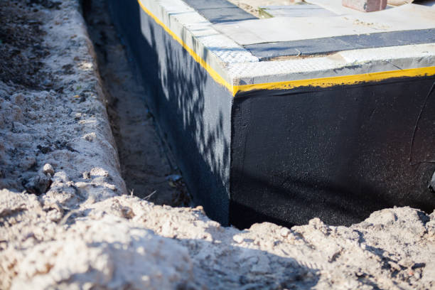 Professional Waterproofing technician working in Burt, MI